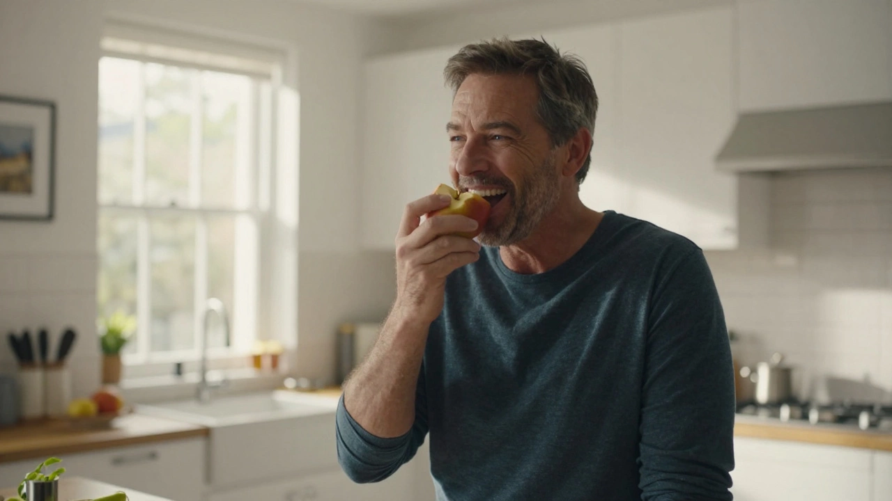 Man smiling and eating an apple confidently after successful dental implant healing